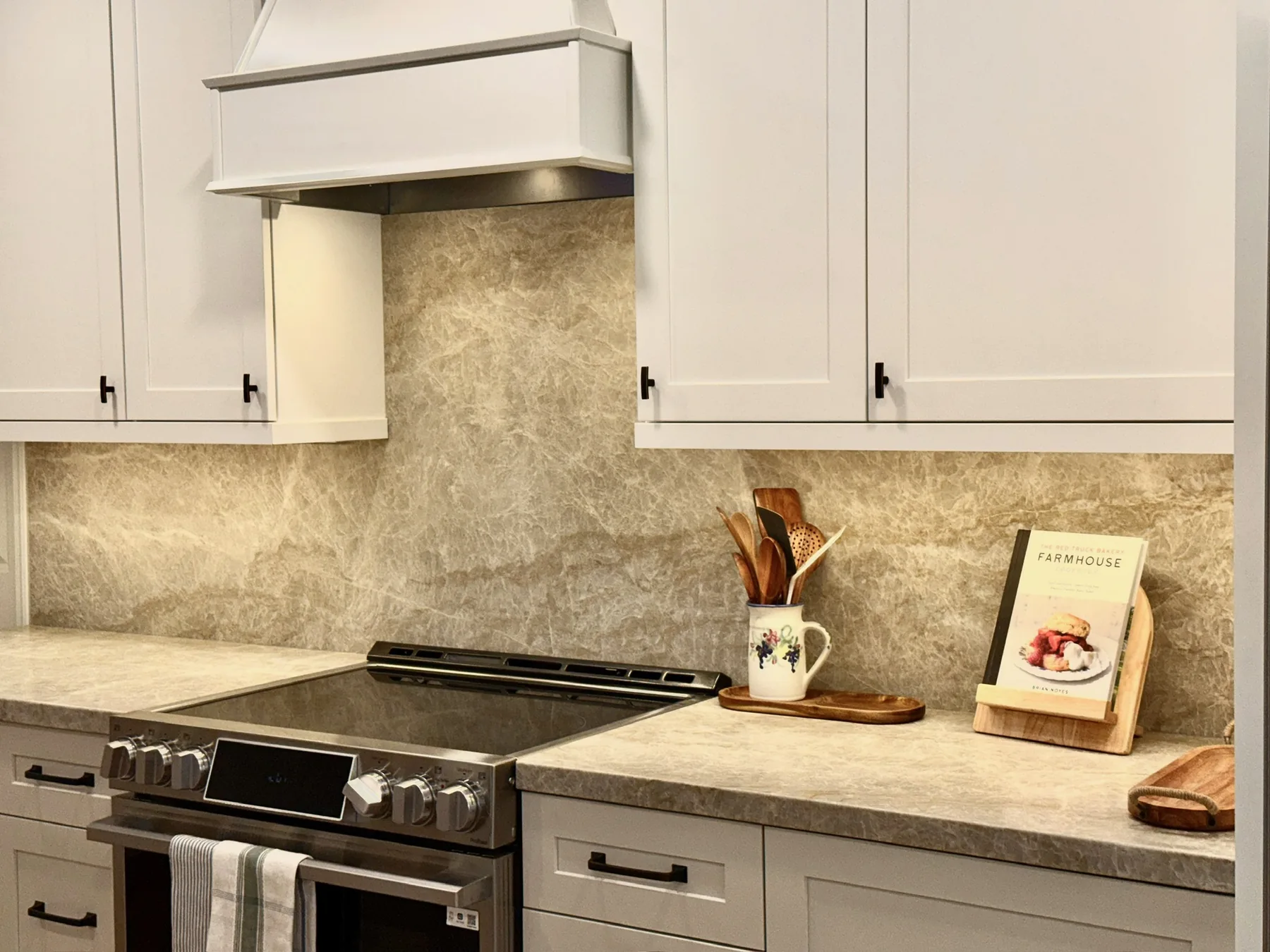 Custom cabinetry and full-height kitchen surfaces